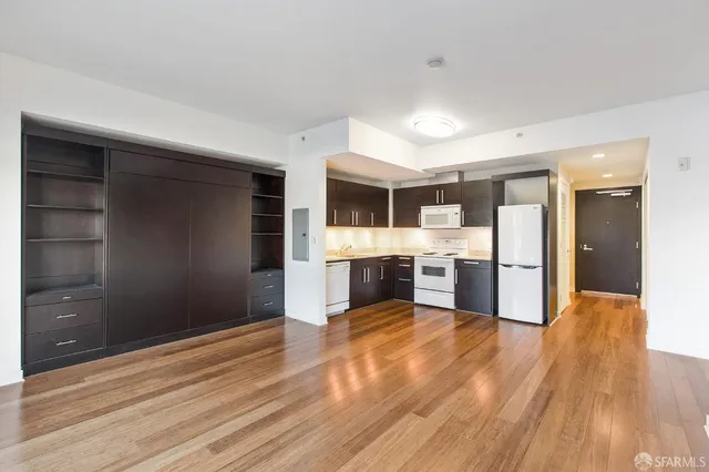 a view of kitchen with wooden floor