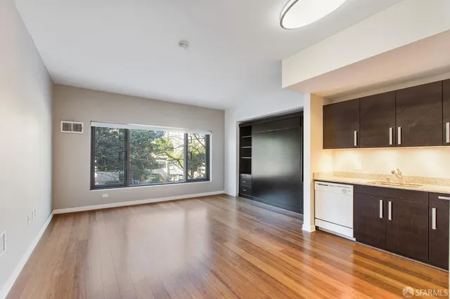a view of a kitchen with a sink and a window