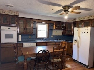 25 Lakeview Street Blackstone, MA 01504 - Photo 2 of 9 a kitchen with a table chairs refrigerator and microwave