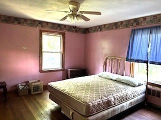 25 Lakeview Street Blackstone, MA 01504 - Photo 5 of 9 a bedroom with a bed and a window