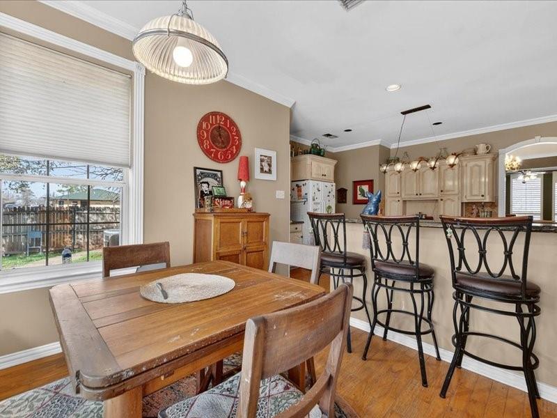 1704 South Bowen Road Pantego, TX 76013 - Photo 12 of 26 a table and chairs in a room