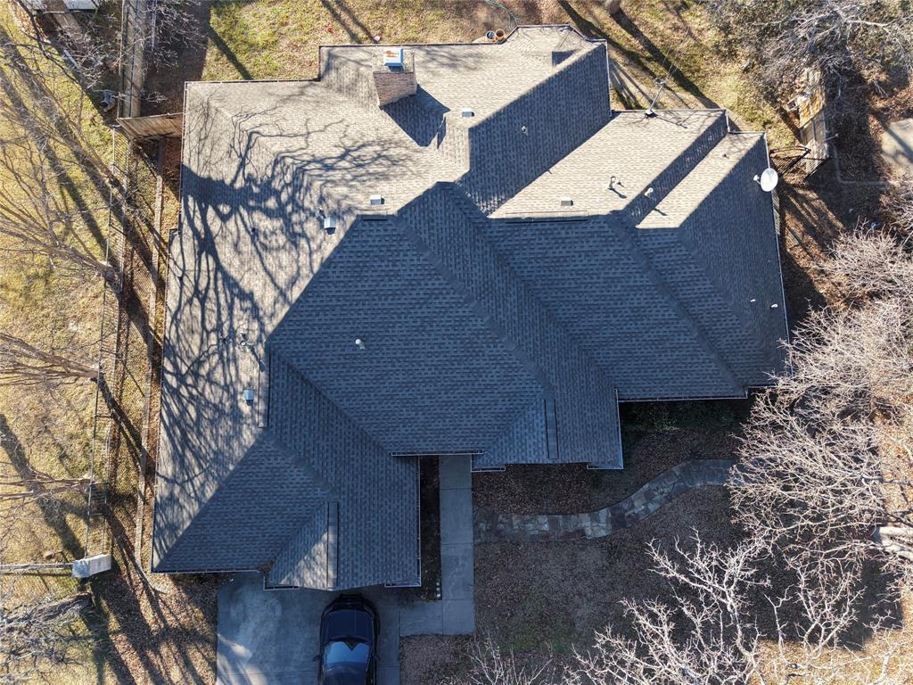 1704 South Bowen Road Pantego, TX 76013 - Photo 2 of 26 a top view of a house with a yard