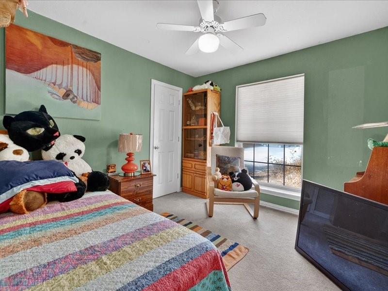 1704 South Bowen Road Pantego, TX 76013 - Photo 22 of 26 a bedroom with a bed gym equipment and view of living room