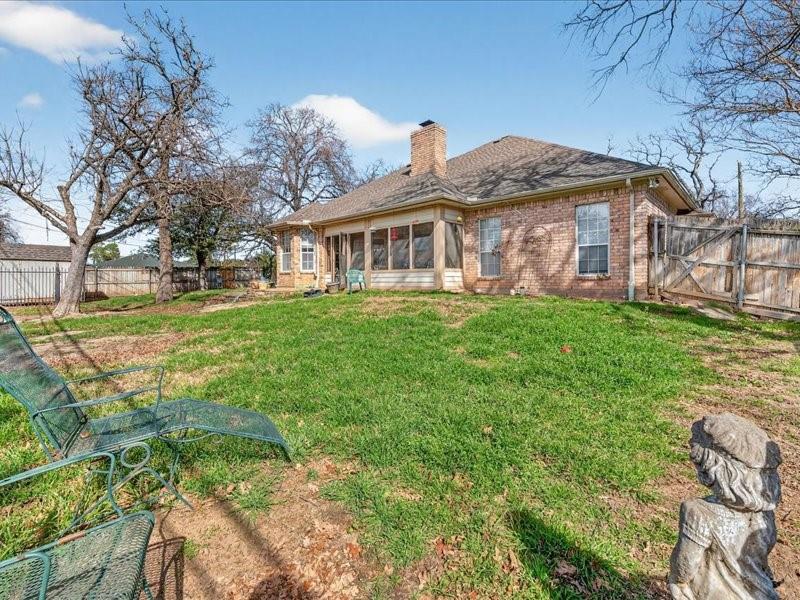 1704 South Bowen Road Pantego, TX 76013 - Photo 26 of 26 a front view of a house with a yard