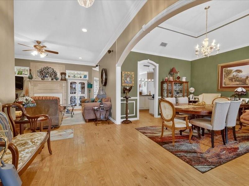1704 South Bowen Road Pantego, TX 76013 - Photo 3 of 26 a living room with furniture and a flat screen tv