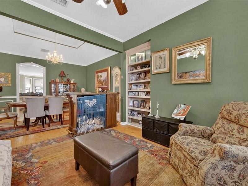 1704 South Bowen Road Pantego, TX 76013 - Photo 5 of 26 a living room with furniture and a dining table