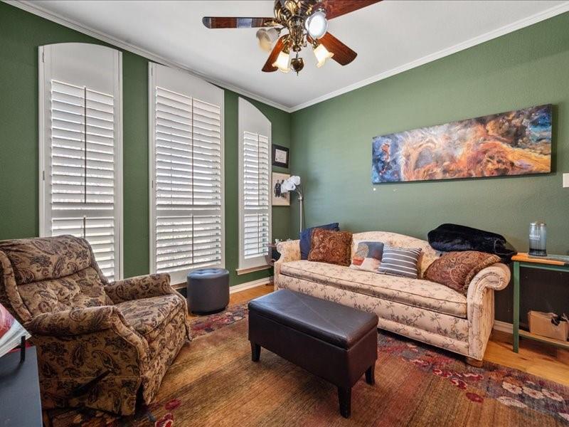 1704 South Bowen Road Pantego, TX 76013 - Photo 6 of 26 a living room with furniture and a window