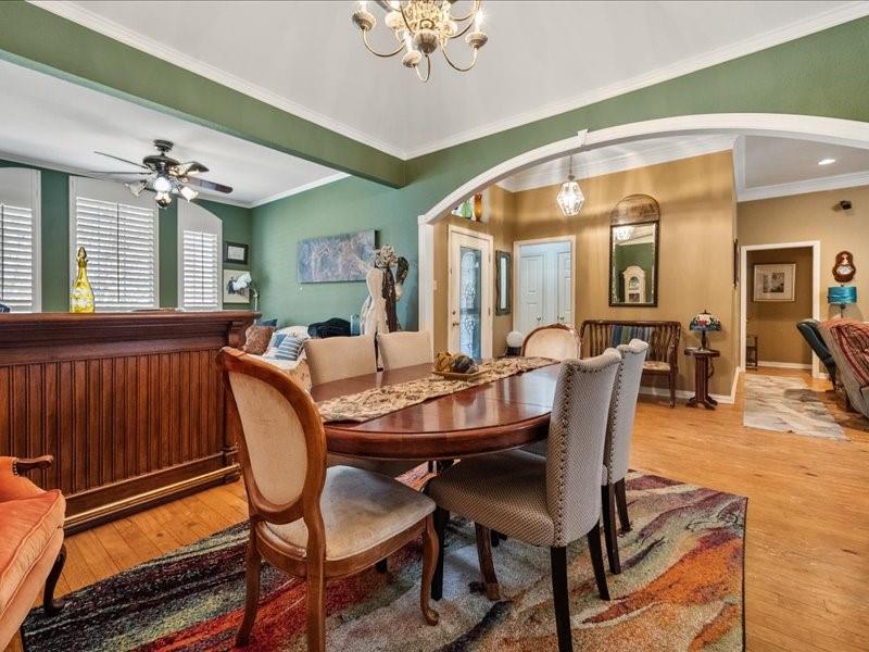 1704 South Bowen Road Pantego, TX 76013 - Photo 8 of 26 a view of a dining room with furniture window and wooden floor