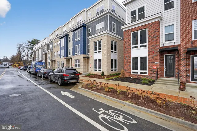 a view of a city street lined with buildings and cars