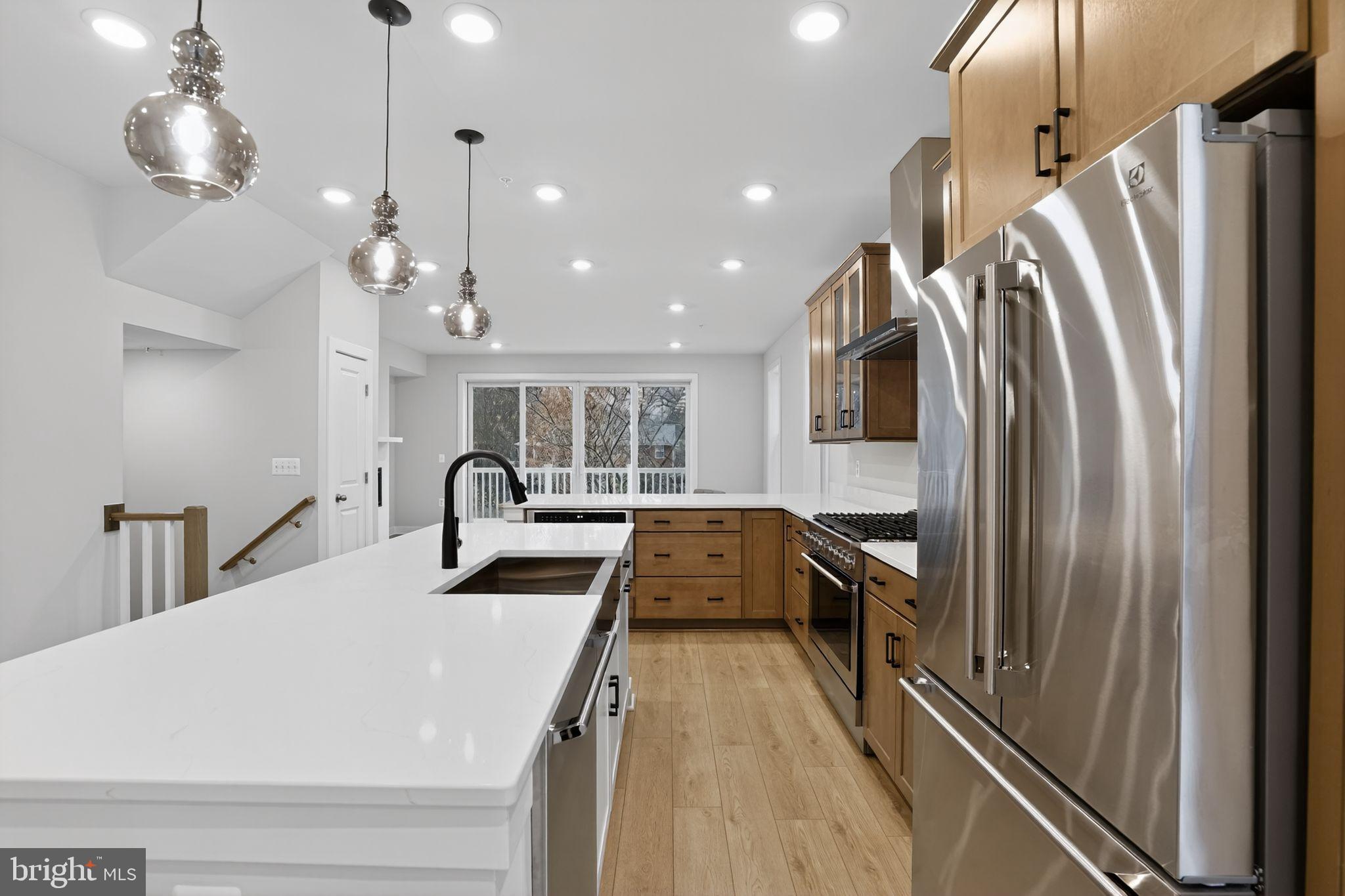 3612 Farr Avenue Fairfax, VA 22030 - Photo 15 of 30 a kitchen with stainless steel appliances a refrigerator sink and cabinets