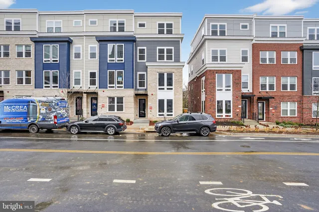 a cars parked in front of a brick building