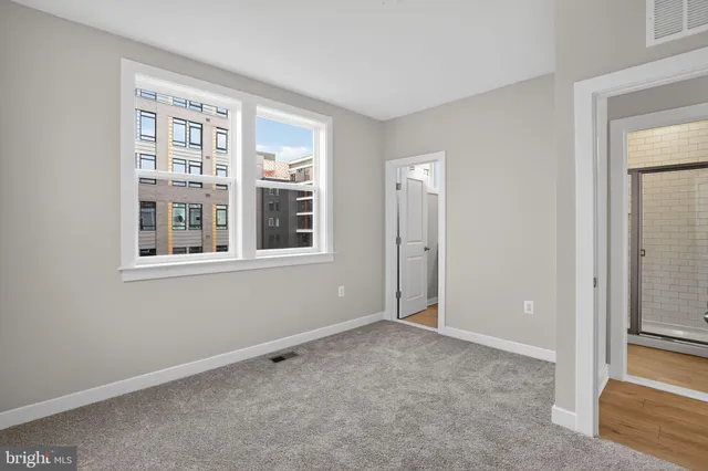 a view of an empty room with a window