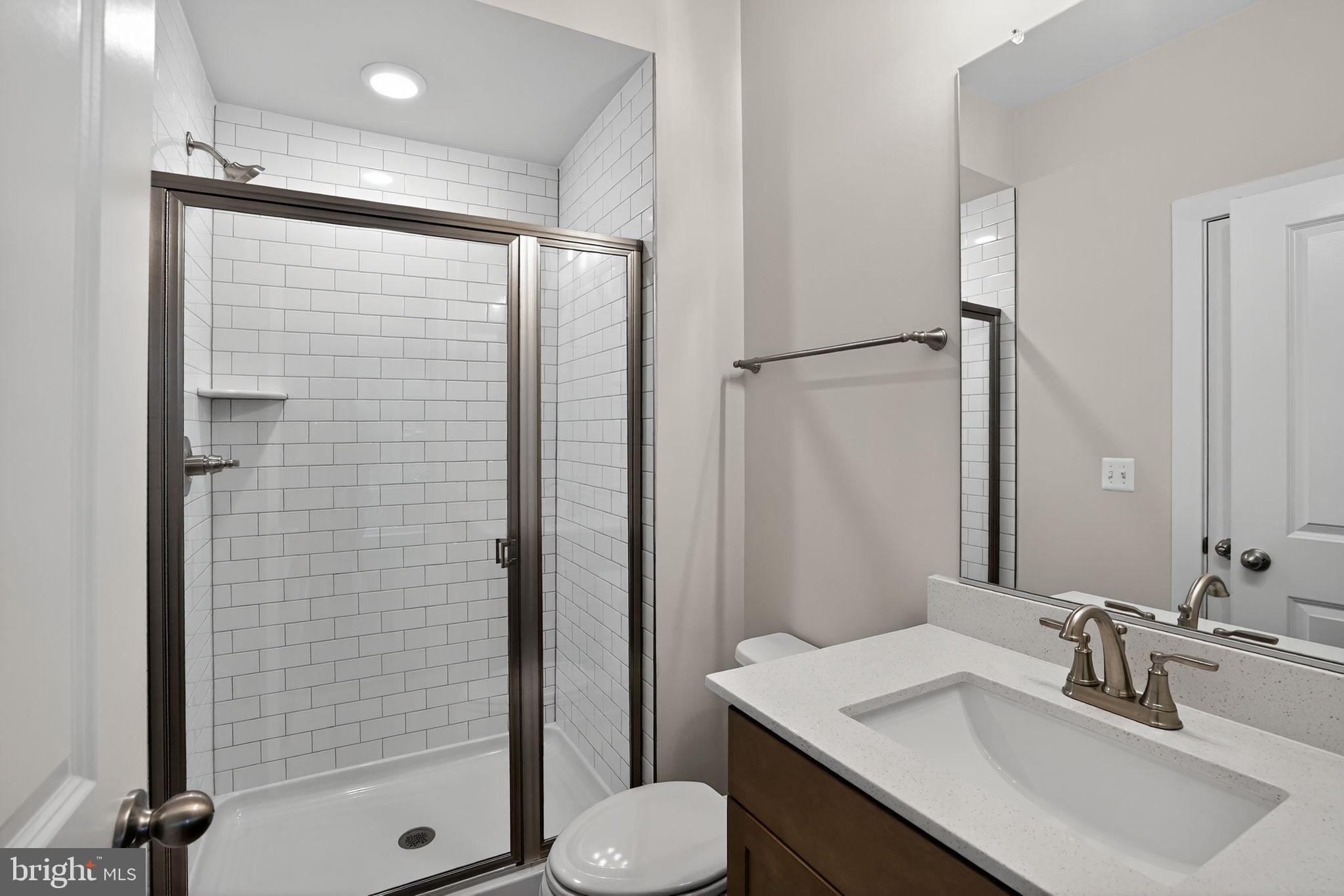 3612 Farr Avenue Fairfax, VA 22030 - Photo 25 of 30 a bathroom with a sink toilet and shower