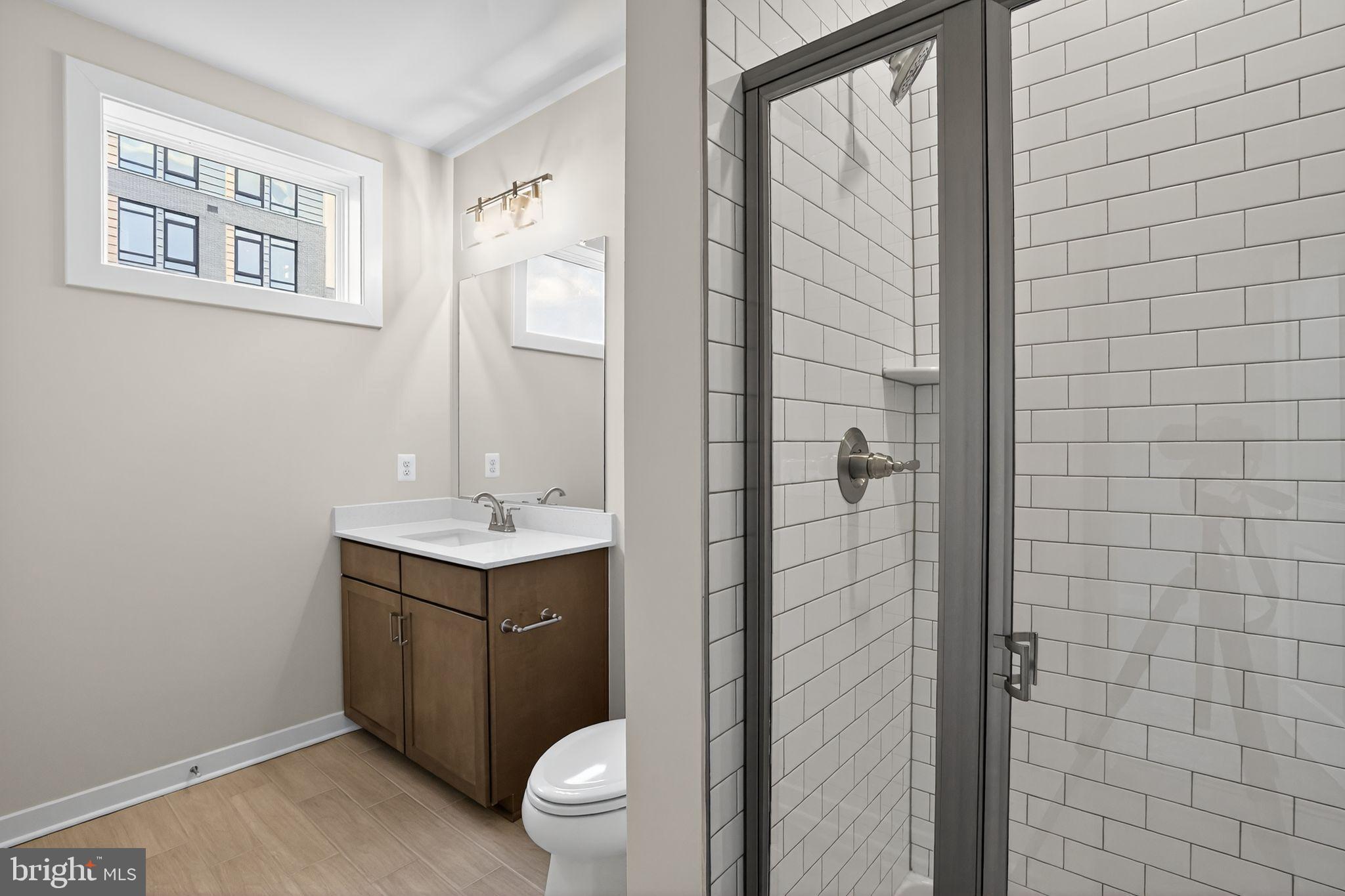 3612 Farr Avenue Fairfax, VA 22030 - Photo 27 of 30 a bathroom with a sink a toilet and shower