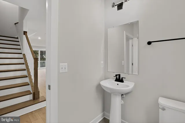 a bathroom with a sink a mirror and a shower