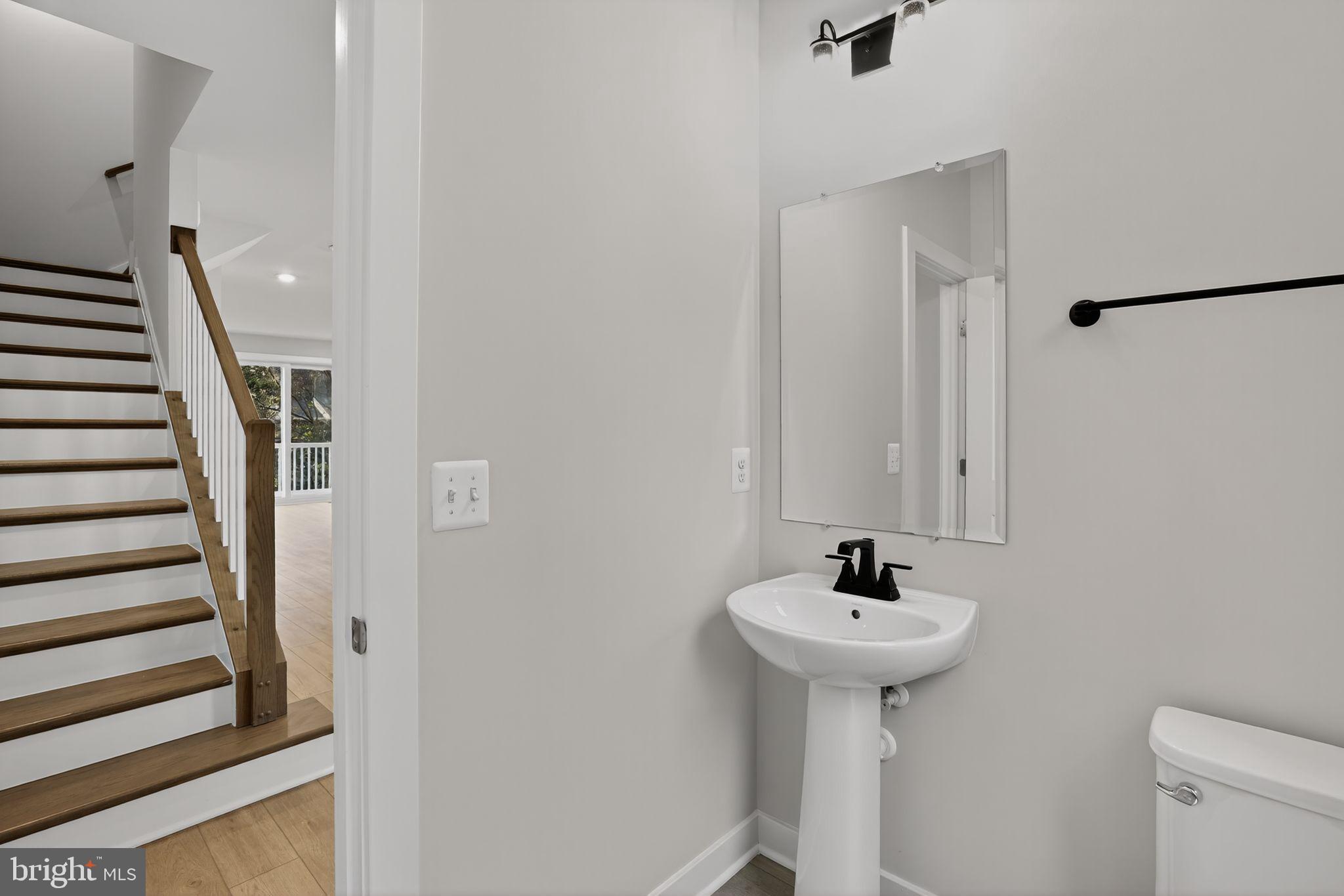 3612 Farr Avenue Fairfax, VA 22030 - Photo 29 of 30 a bathroom with a sink a mirror and a shower