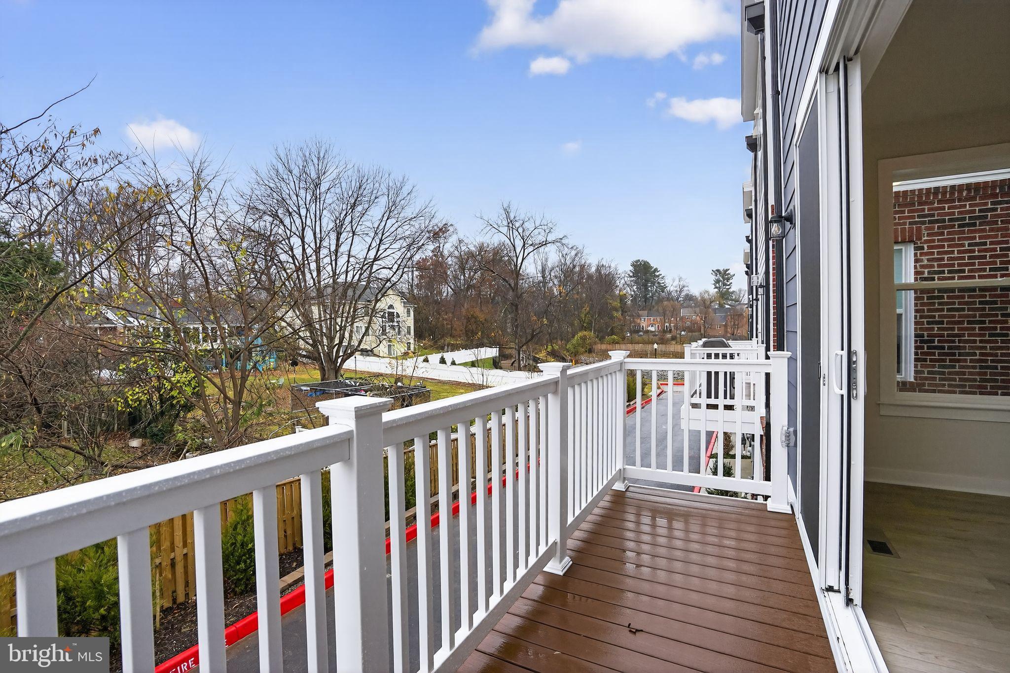 3612 Farr Avenue Fairfax, VA 22030 - Photo 6 of 30 a view of a balcony with wooden floor and fence