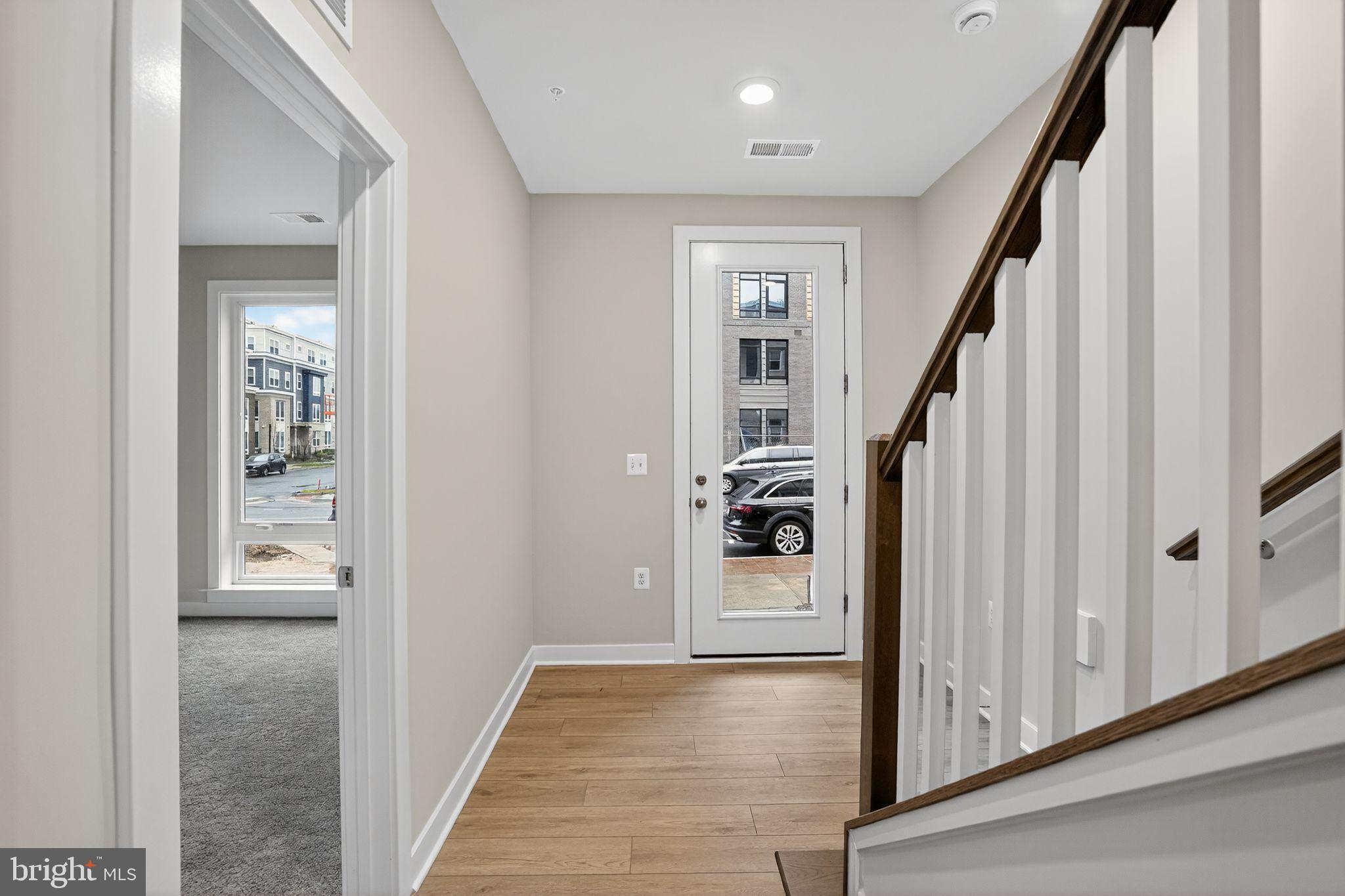 3612 Farr Avenue Fairfax, VA 22030 - Photo 8 of 30 a view of a hallway with wooden floor and staircase