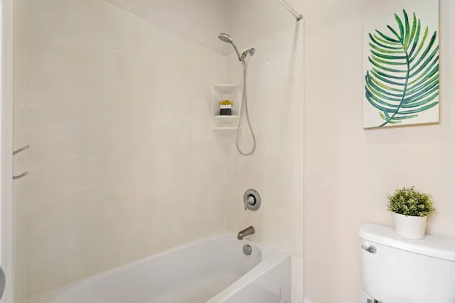 a bathroom with a shower curtain and a bathtub