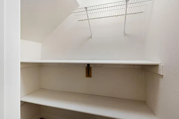 a view of a room with racks on the wall