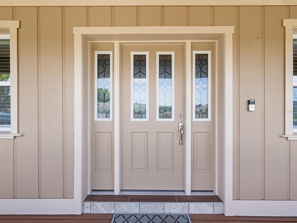5904 Springrun Court Holiday, FL 34690 - Photo 12 of 53 front view of a door with wooden door