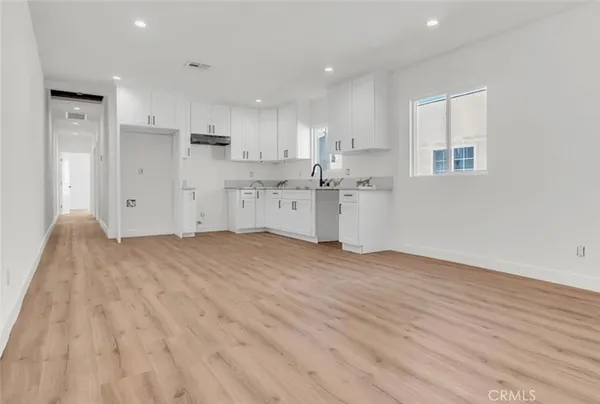 a view of kitchen with wooden floor