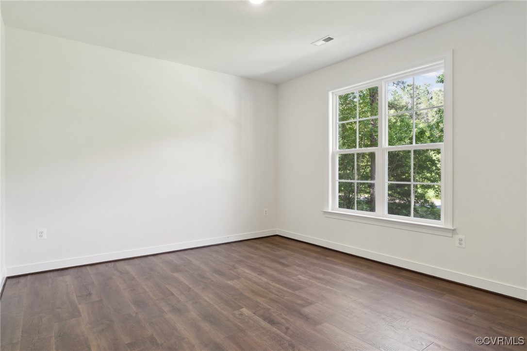 340 Rainbow Ridge Bumpass, VA 23024 - Photo 12 of 29 an empty room with wooden floor and windows