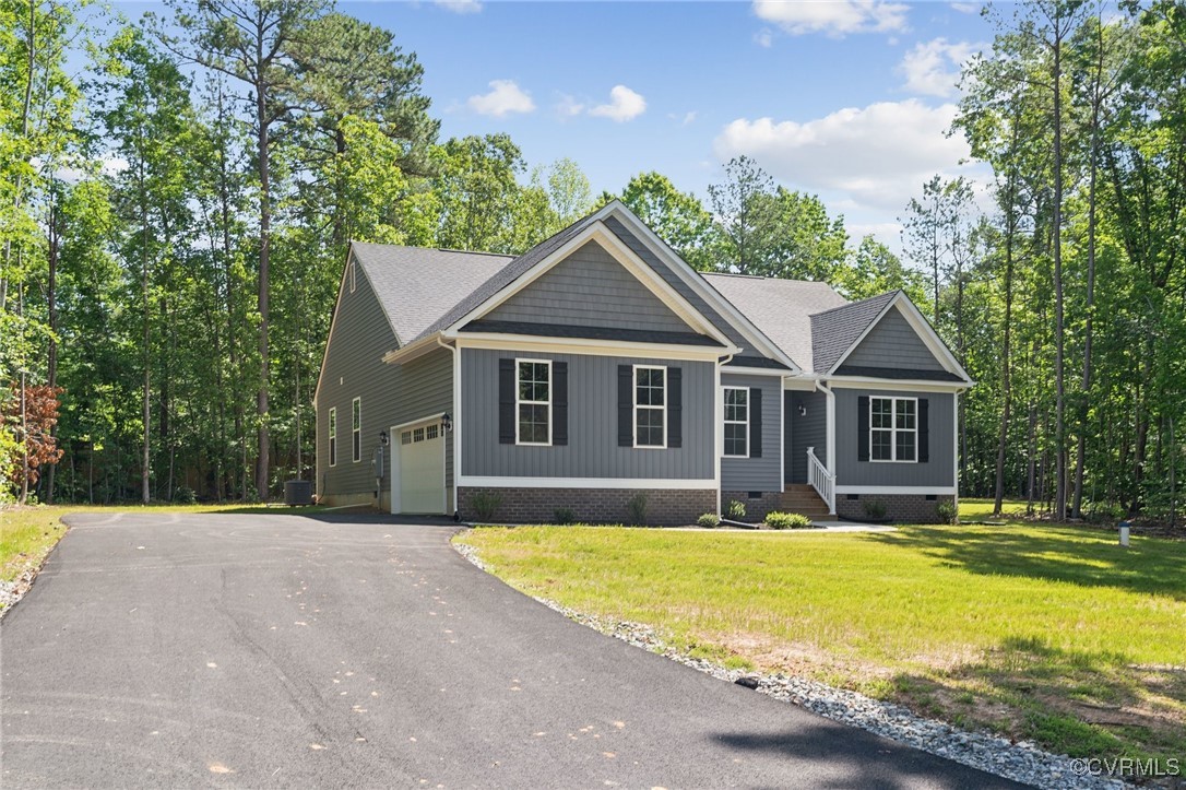 340 Rainbow Ridge Bumpass, VA 23024 - Photo 25 of 29 a front view of a house with yard and green space