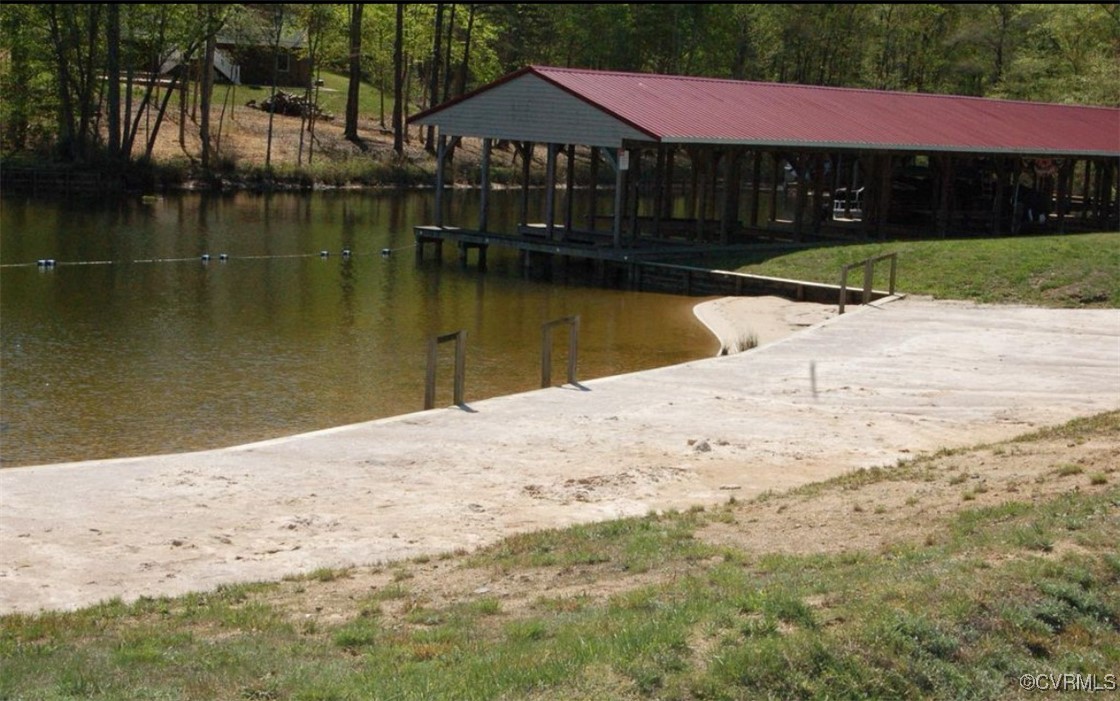 340 Rainbow Ridge Bumpass, VA 23024 - Photo 26 of 29 a view of swimming pool with lawn chairs and wooden fence