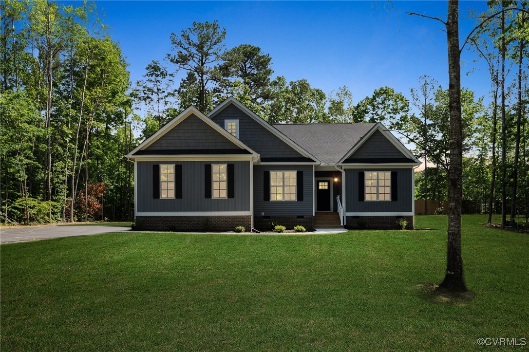 340 Rainbow Ridge Bumpass, VA 23024 - Photo 3 of 29 a front view of a house with a yard