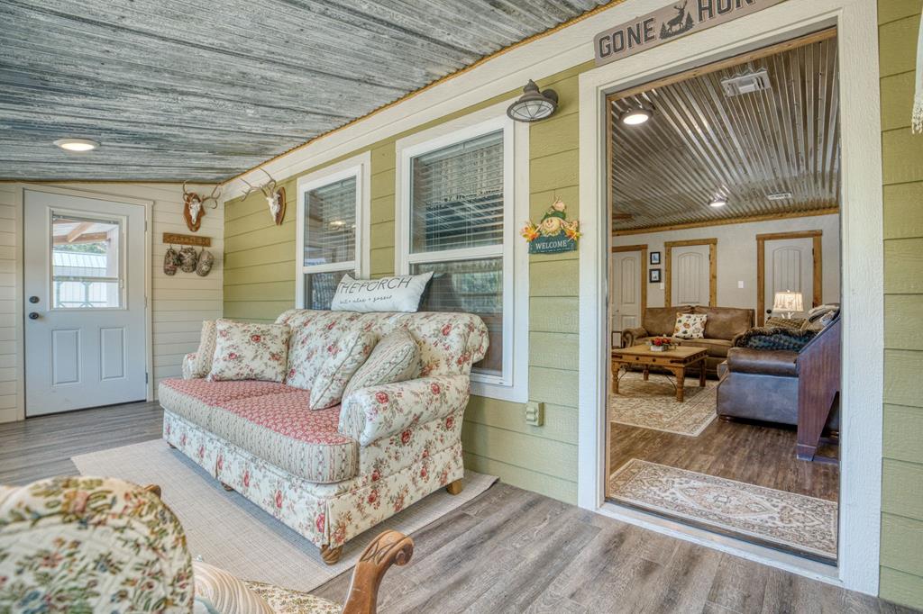25525 Ranch Road 2323 Llano, TX 78643 - Photo 14 of 40 a view of a livingroom with furniture and windows