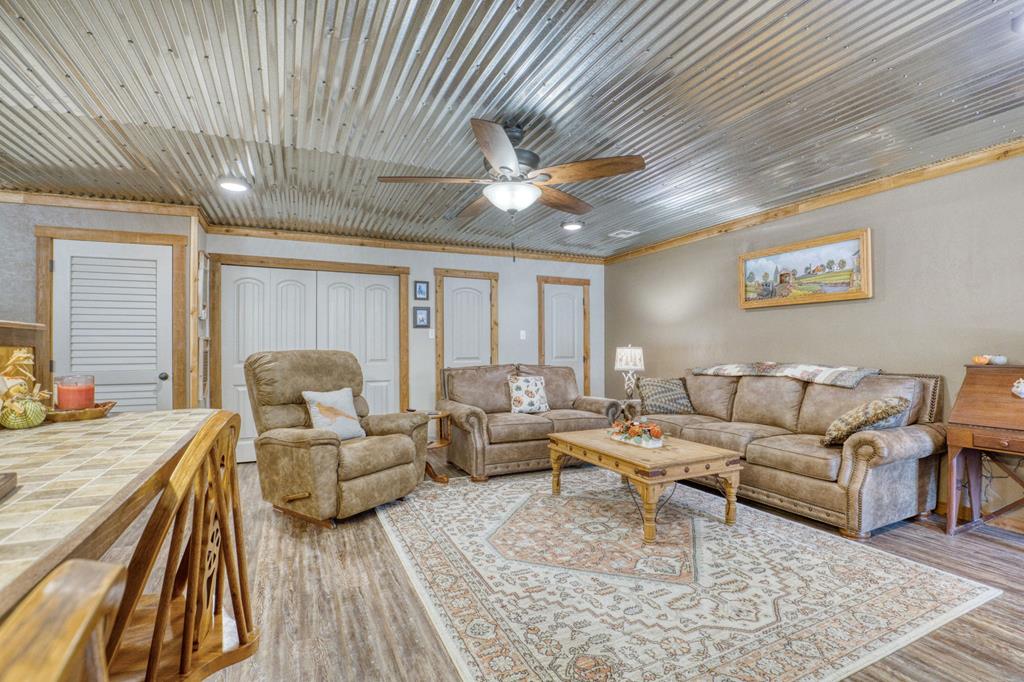 25525 Ranch Road 2323 Llano, TX 78643 - Photo 16 of 40 a living room with furniture and a large window