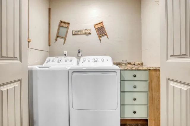 a utility room with dryer and washer