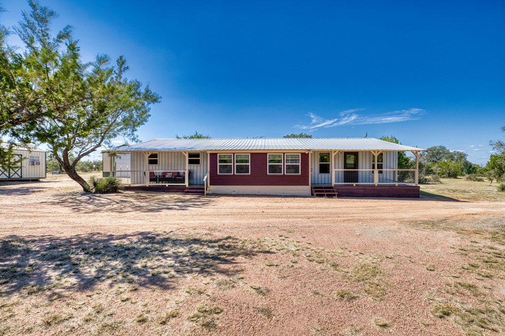 25525 Ranch Road 2323 Llano, TX 78643 - Photo 4 of 40 a front view of a house with a yard