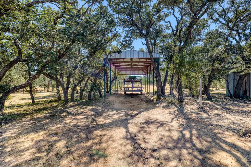 25525 Ranch Road 2323 Llano, TX 78643 - Photo 9 of 40 a view of a house with a tree