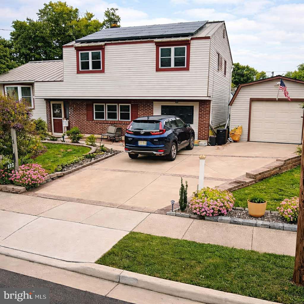 Charming home with vibrant gardens.