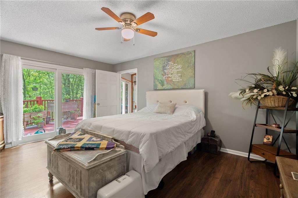 816 Mulligan Way Jasper, GA 30143 - Photo 17 of 36 a bedroom with bed and a large window