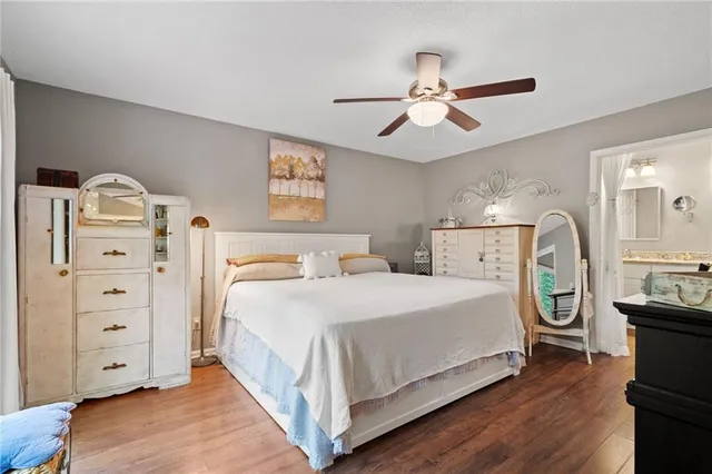 a spacious bedroom with a bed and a cabinets