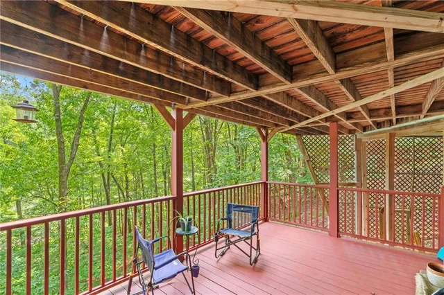 a view of porch with wooden floor and furniture