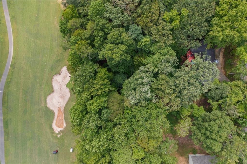816 Mulligan Way Jasper, GA 30143 - Photo 33 of 36 a backyard of a house with a seating space and deck