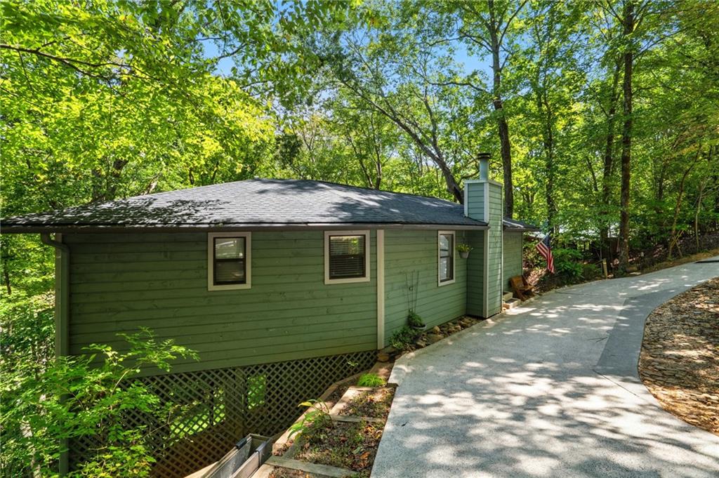 816 Mulligan Way Jasper, GA 30143 - Photo 4 of 36 a front view of a house with garden
