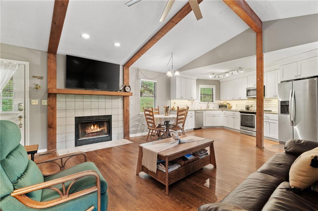 816 Mulligan Way Jasper, GA 30143 - Photo 10 of 36 a living room with furniture fireplace and flat screen tv