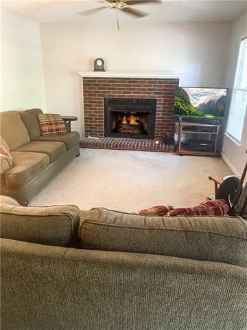 a living room with a couch and a fireplace