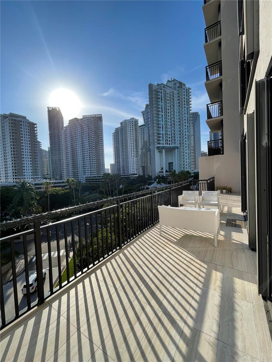540 Brickell Key Drive, Unit 711 Miami, FL 33131 - Photo 30 of 37 a view of balcony with outdoor seating and city view