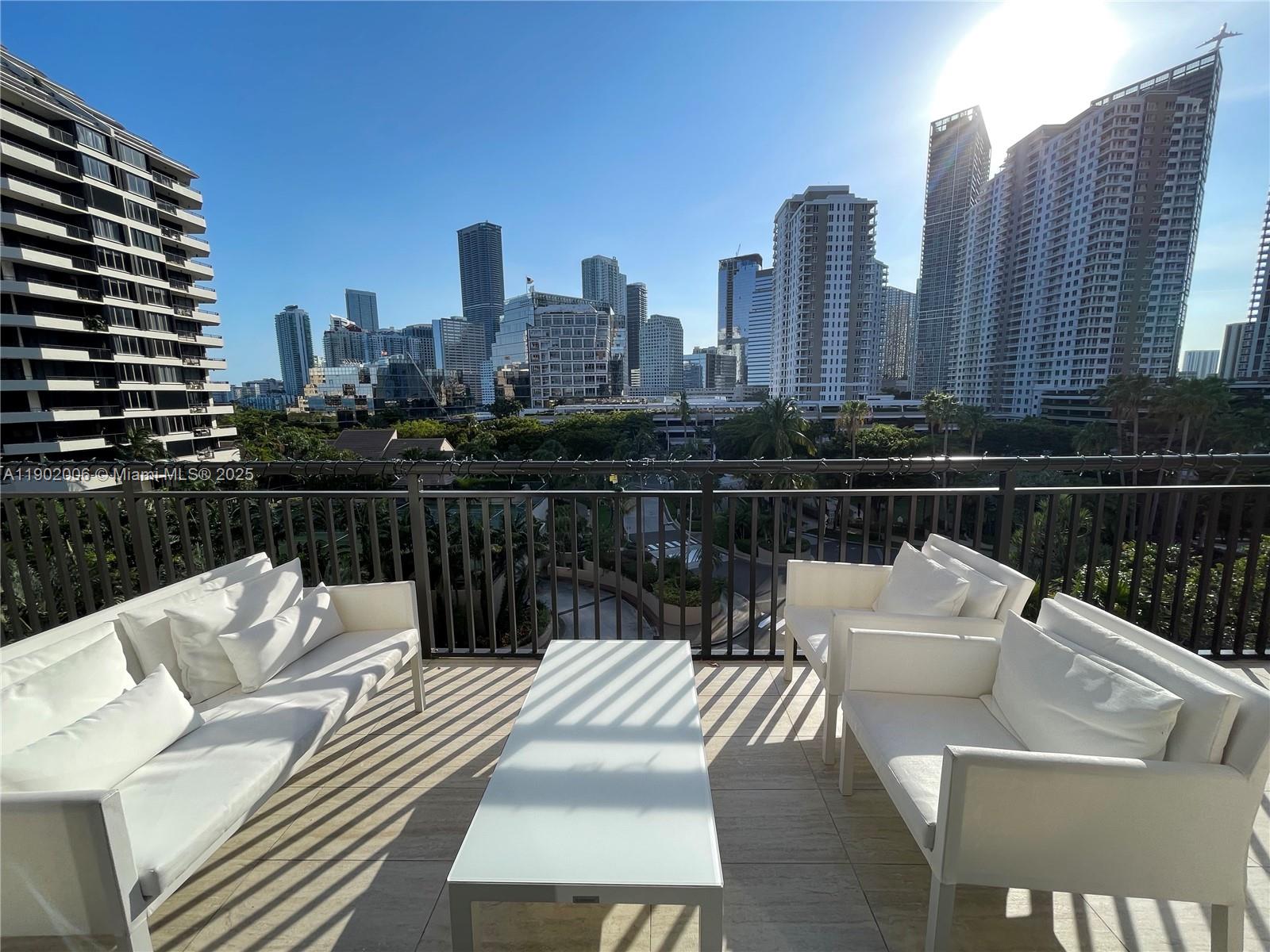 540 Brickell Key Drive, Unit 711 Miami, FL 33131 - Photo 3 of 37 a view of city from a roof with sitting area