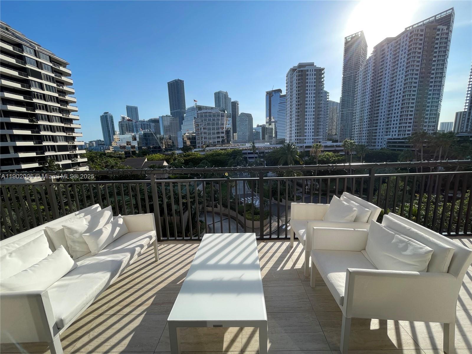 540 Brickell Key Drive, Unit 711 Miami, FL 33131 - Photo 31 of 37 a view of city from a roof with sitting area