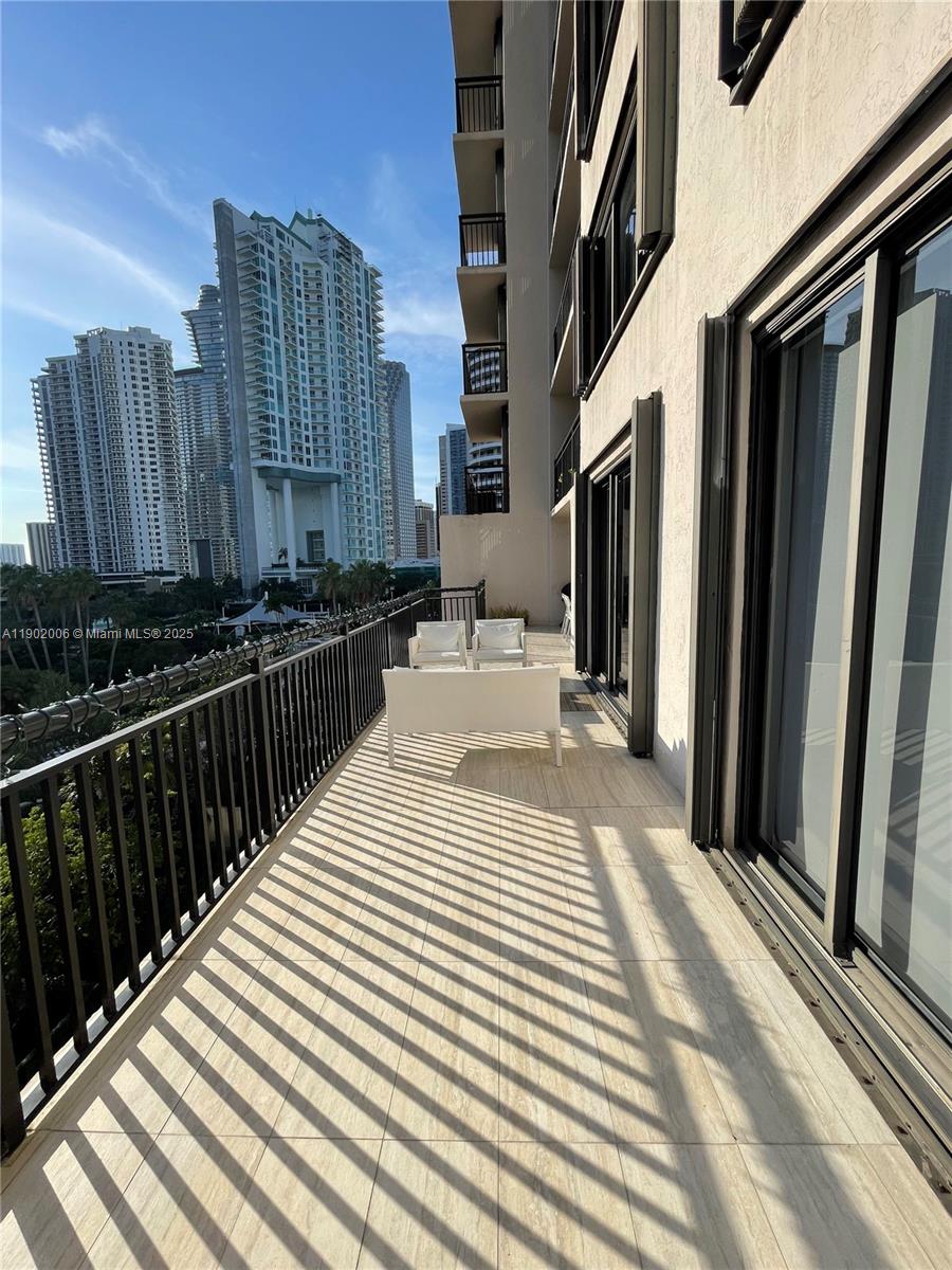 540 Brickell Key Drive, Unit 711 Miami, FL 33131 - Photo 34 of 37 a view of a balcony with furniture