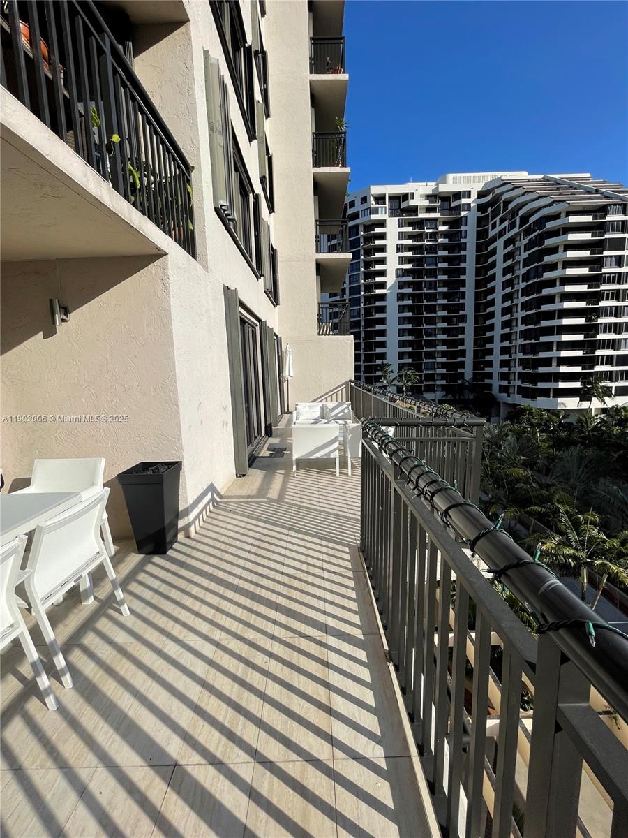 540 Brickell Key Drive, Unit 711 Miami, FL 33131 - Photo 36 of 37 a view of balcony with wooden floor and city view