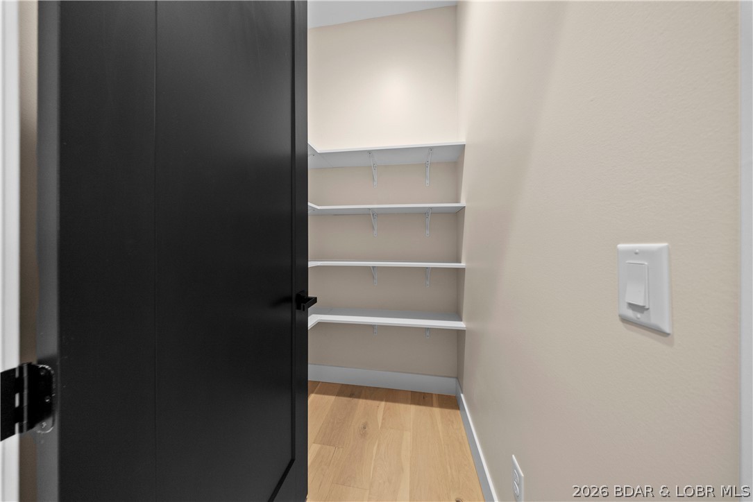439 Red Bud Road Lake Ozark, MO 65049 - Photo 58 of 98 Walk-in storage area with built-in shelving provid