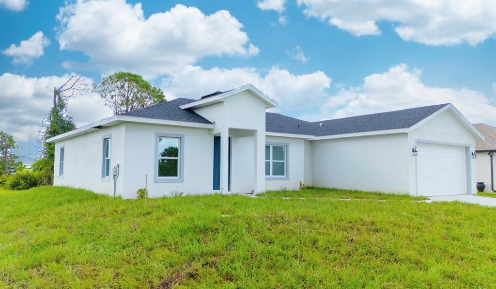 46 Master Drive Placida, FL 33946 - Photo 15 of 44 a view of a house with yard and a garden